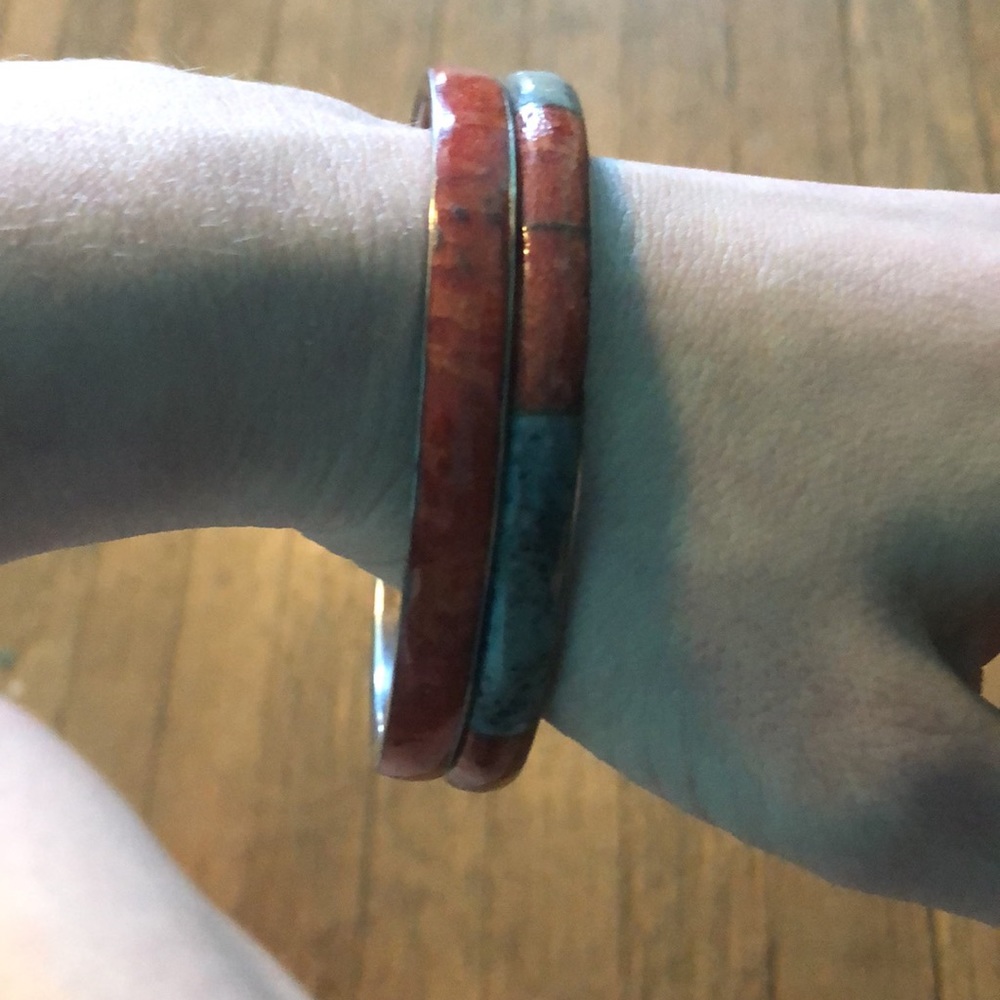 Two bangles silver back, one is red one is red and blue